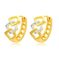 Gold electroplated geometric hollow-out earrings with ear clip fastening on white background