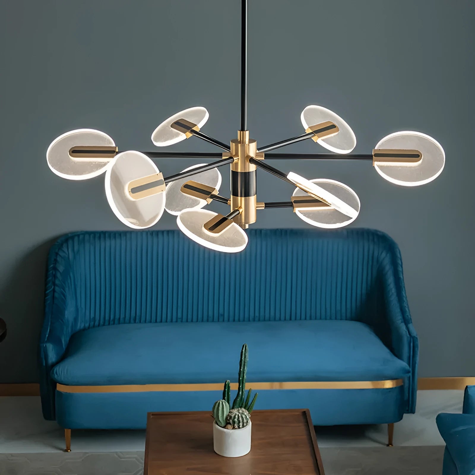 Nordic style iron frame LED chandelier with multiple acrylic lamp shades suspended.