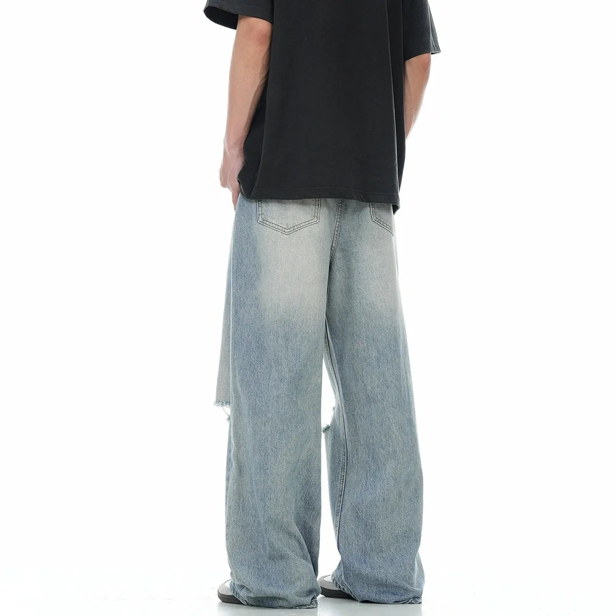 Blue men's straight-leg jeans with a distressed retro finish and a zipper fly.