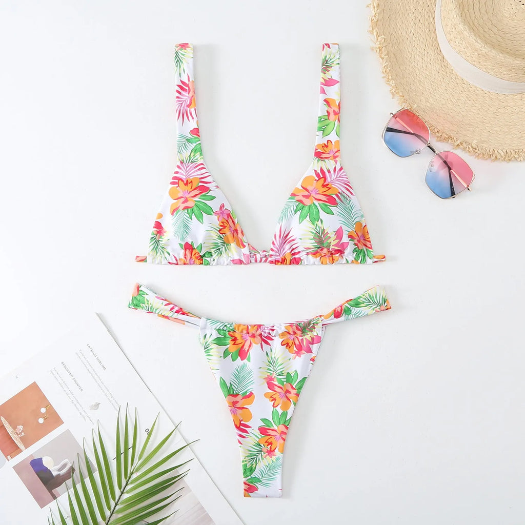 Women's floral print bikini swimsuit in blue colour with briefs style on mannequin
