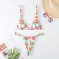 Women's floral print bikini swimsuit in blue colour with briefs style on mannequin