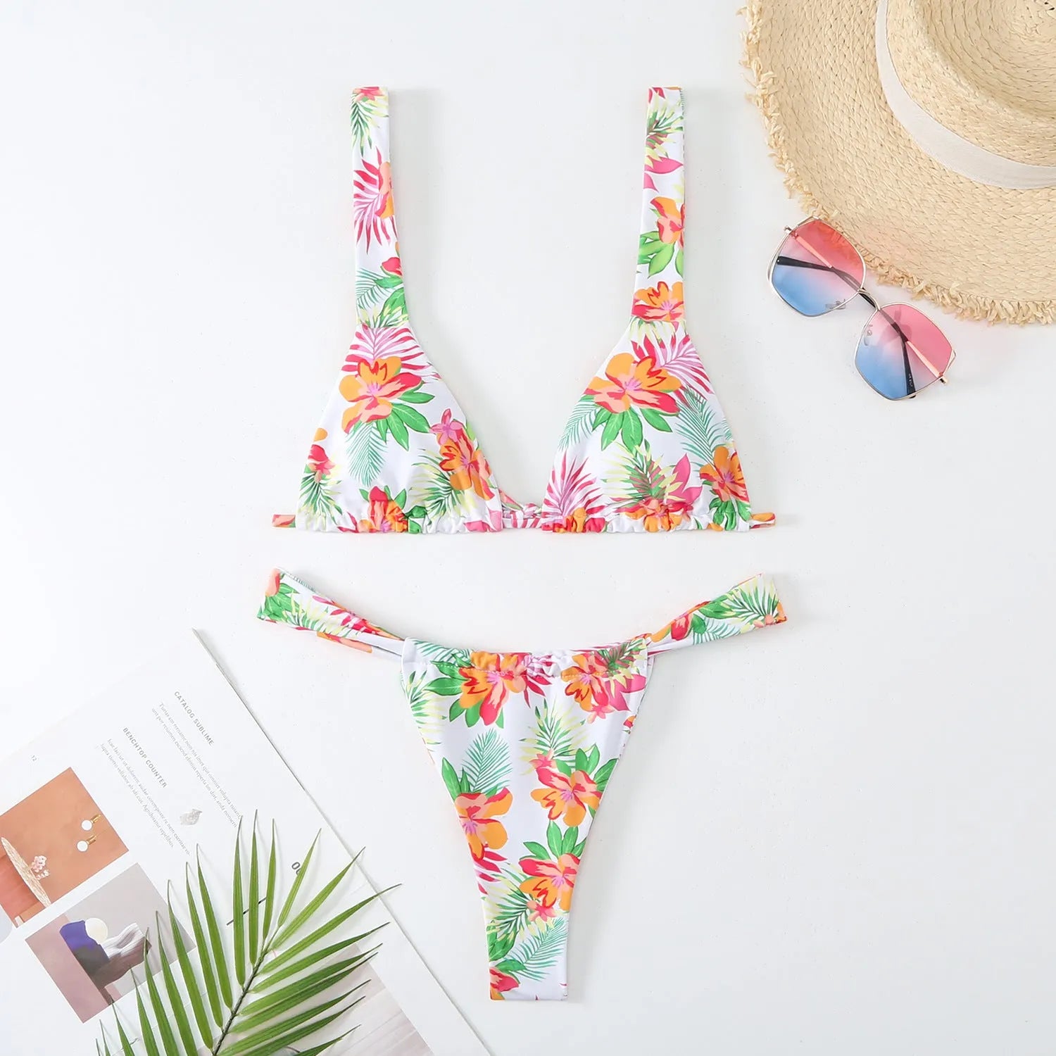 Women's floral print bikini swimsuit in blue colour with briefs style on mannequin