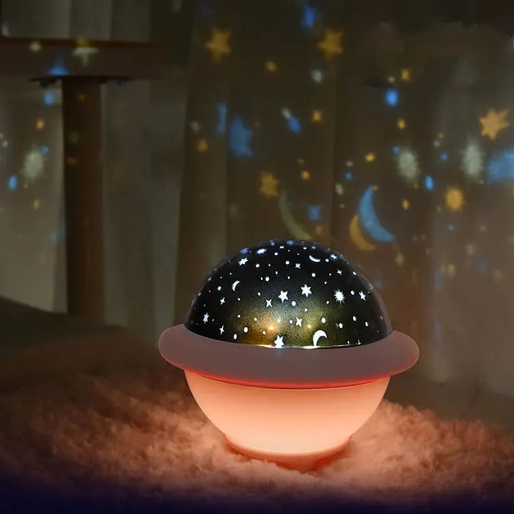 UFO-shaped star projection night light in green colour with USB cable