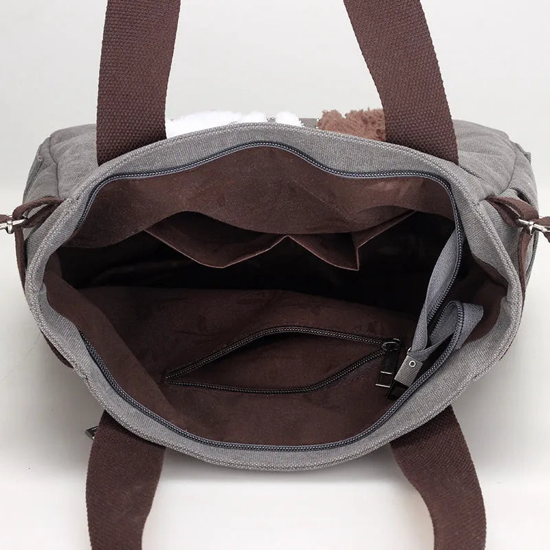 KVKY women canvas shoulder bag with cute plush cat applique in beige colour on white background