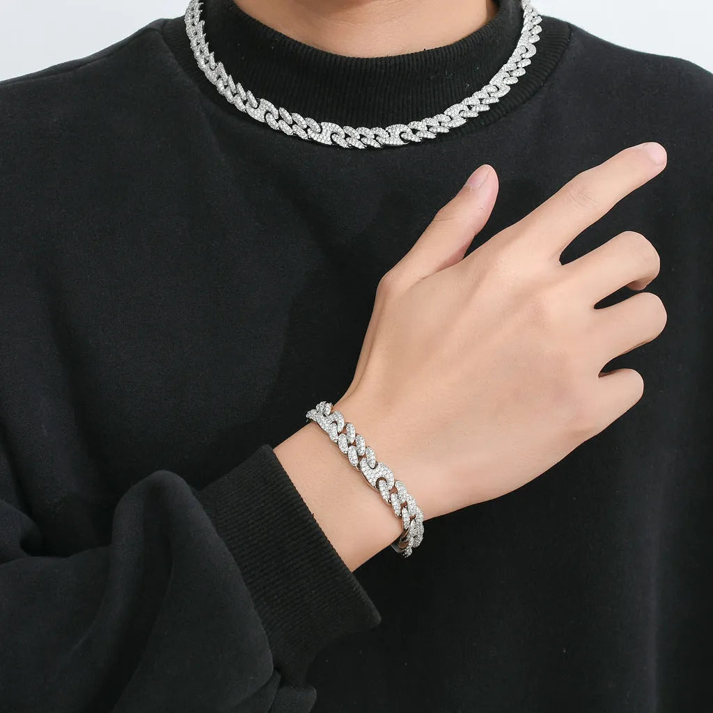 Micro inlaid zircon Cuban chain hip hop bracelet in gold and silver on a flat surface