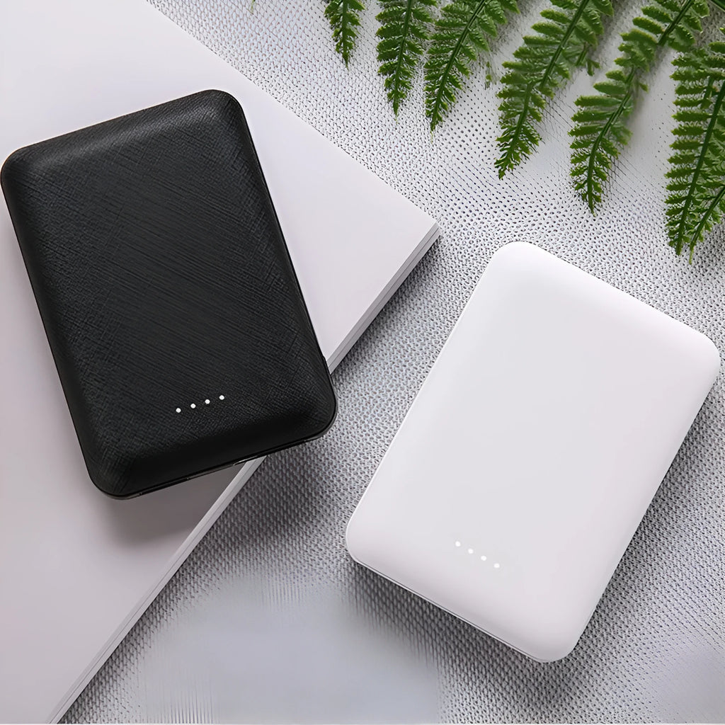 Black and white ultra-thin 10,000mAh power bank showing multi-U port output and compact 90x63x22mm dimensions
