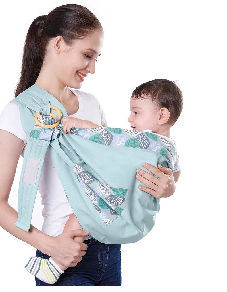 Baby wrap carrier sling in blue-green cotton mesh fabric, adjustable for newborn to 36 months, 50kg capacity