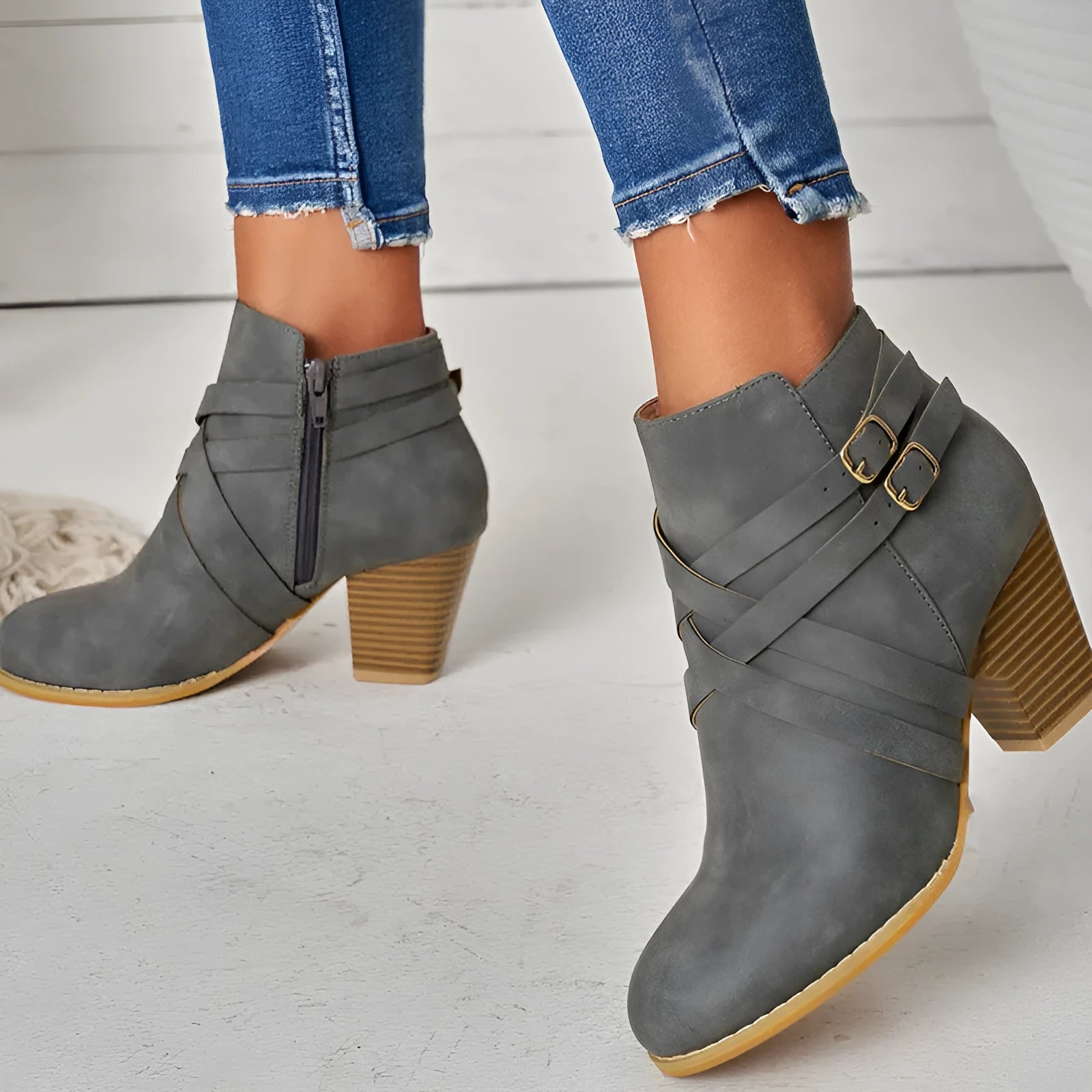 Women's black PU leather ankle boot with side zipper and 7cm heel on a rubber sole
