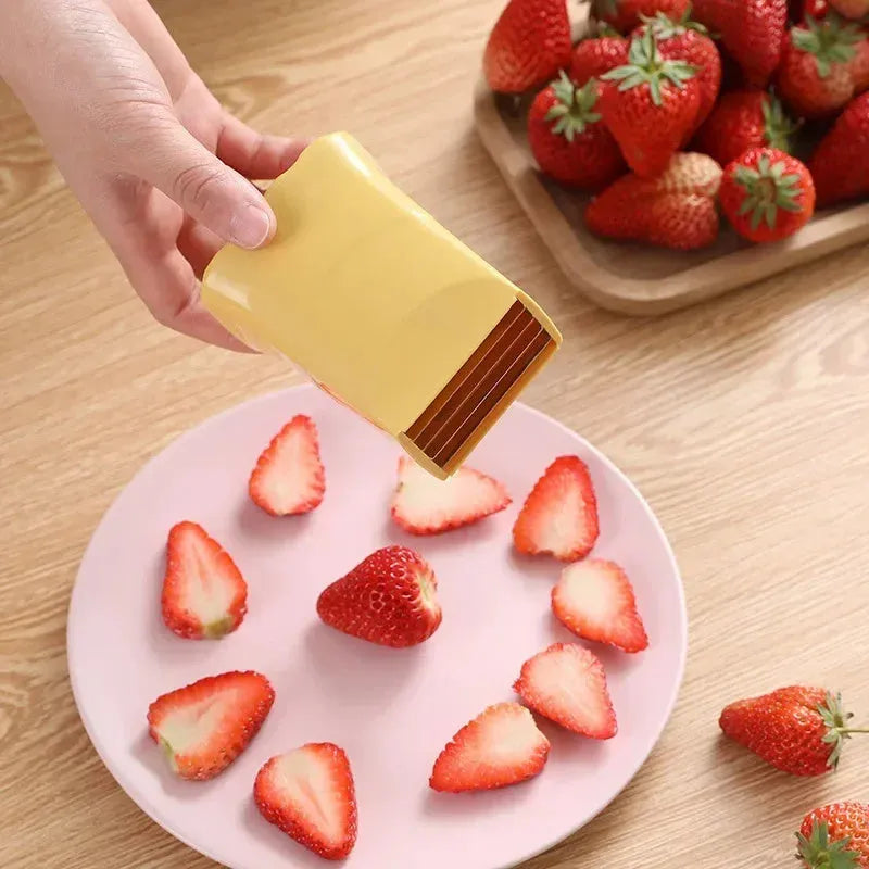 Green stainless steel cup slicer for fruit and vegetable cutting with compact design and visible blade area