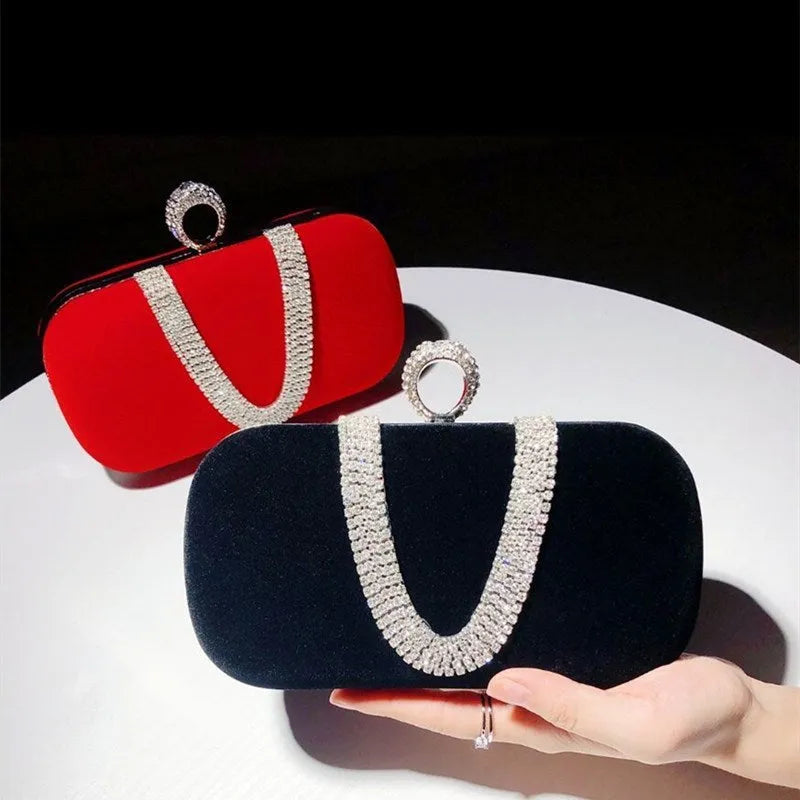 Small velvet clutch evening bag with rhinestones, lock closure, and detachable handle in black