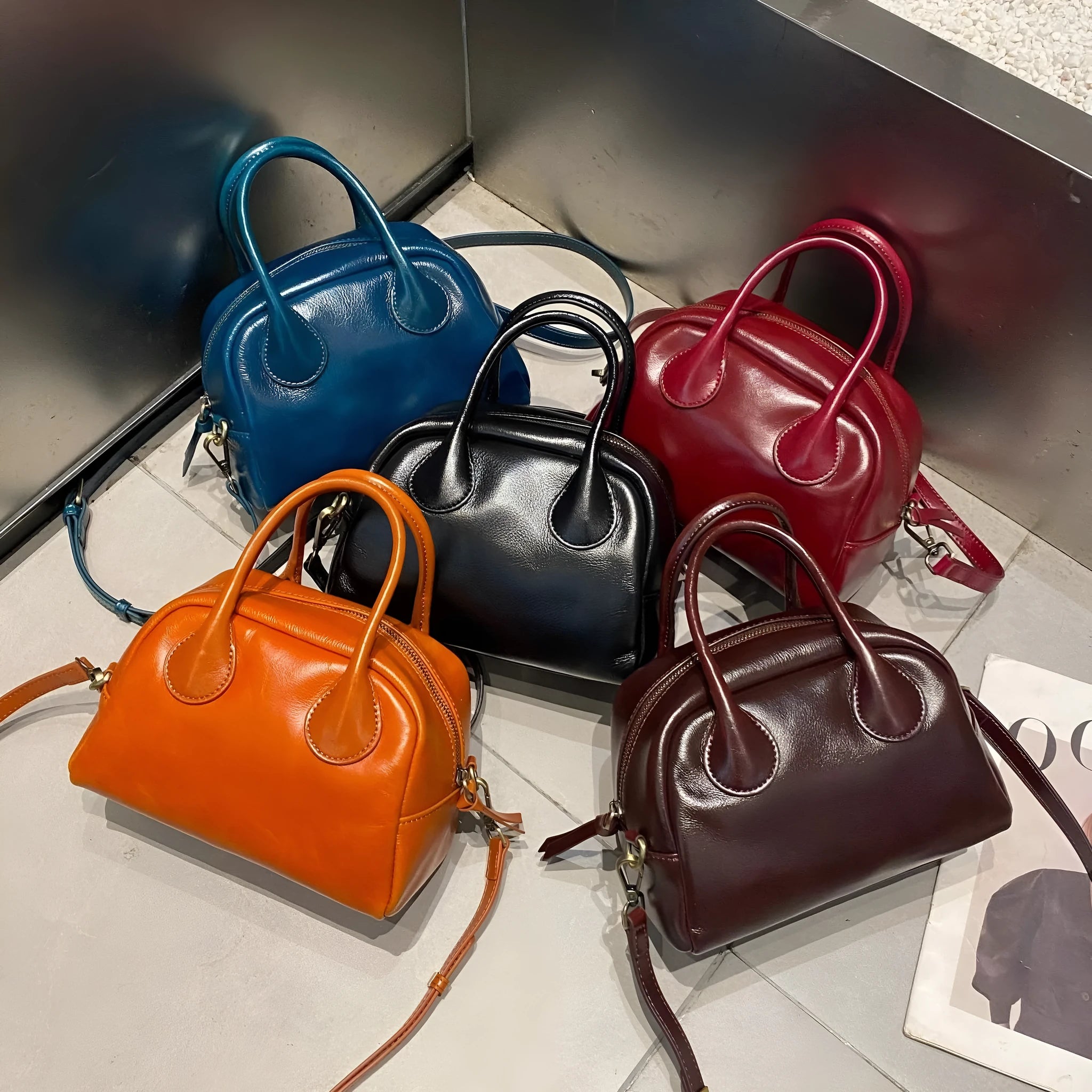 Genuine leather mini bowling bag in pillow shape, top grain leather, 24cm, with single strap, five colour options