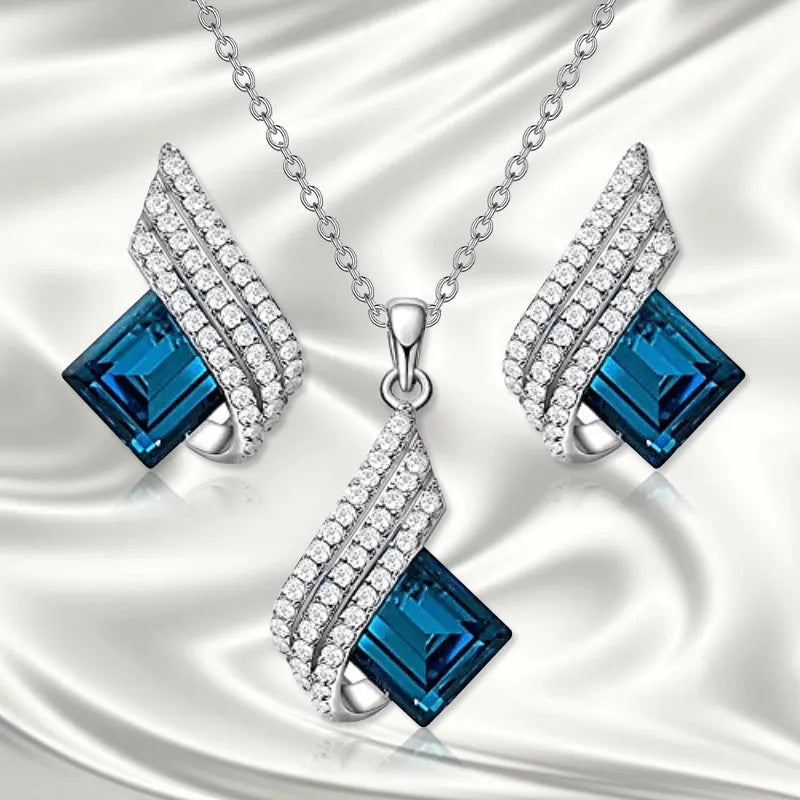Glass pendant necklace with cross chain and matching electroplated alloy ear studs jewellery set