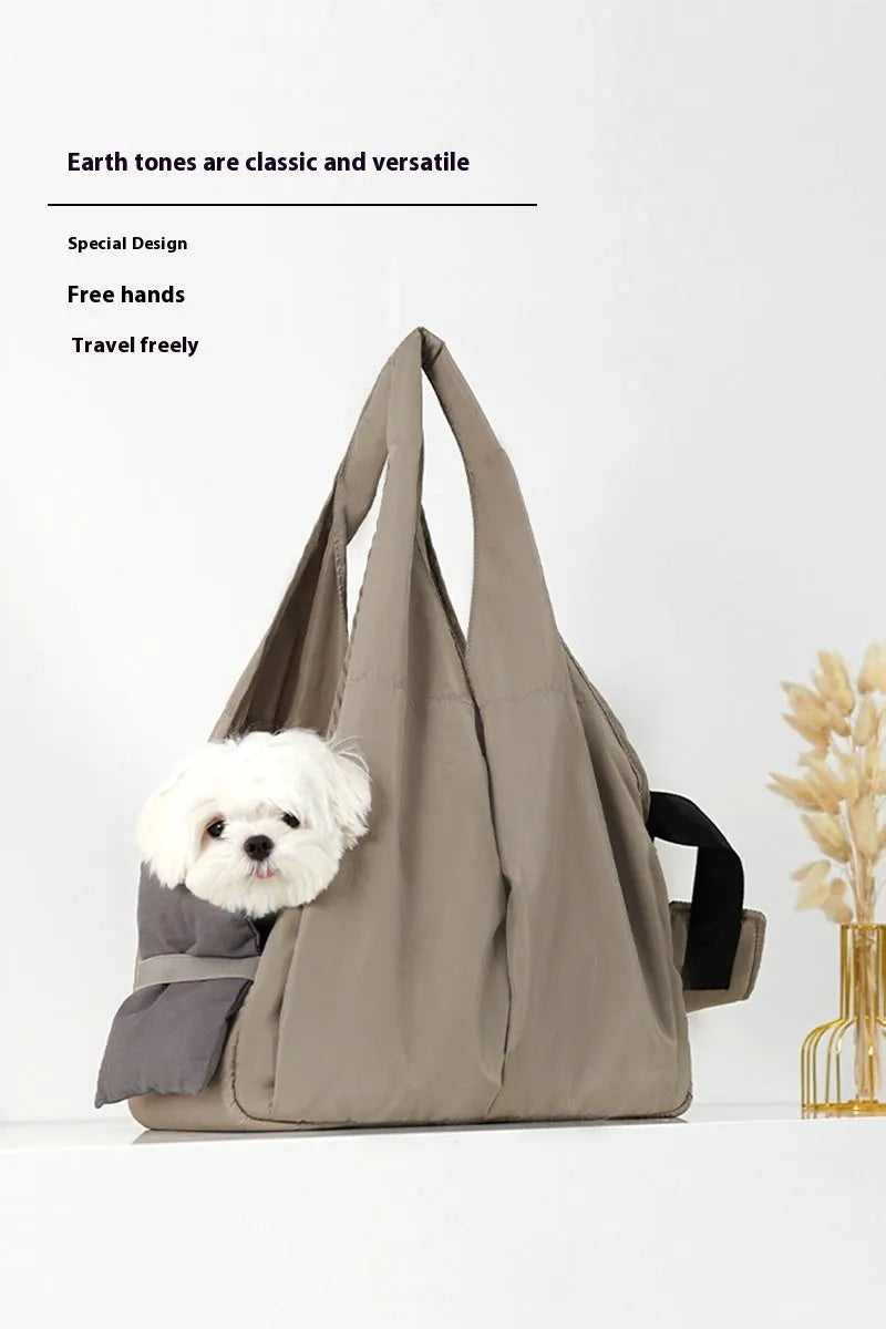 Apricot-coloured cloth pet carrier handbag for outdoor use with small pets.