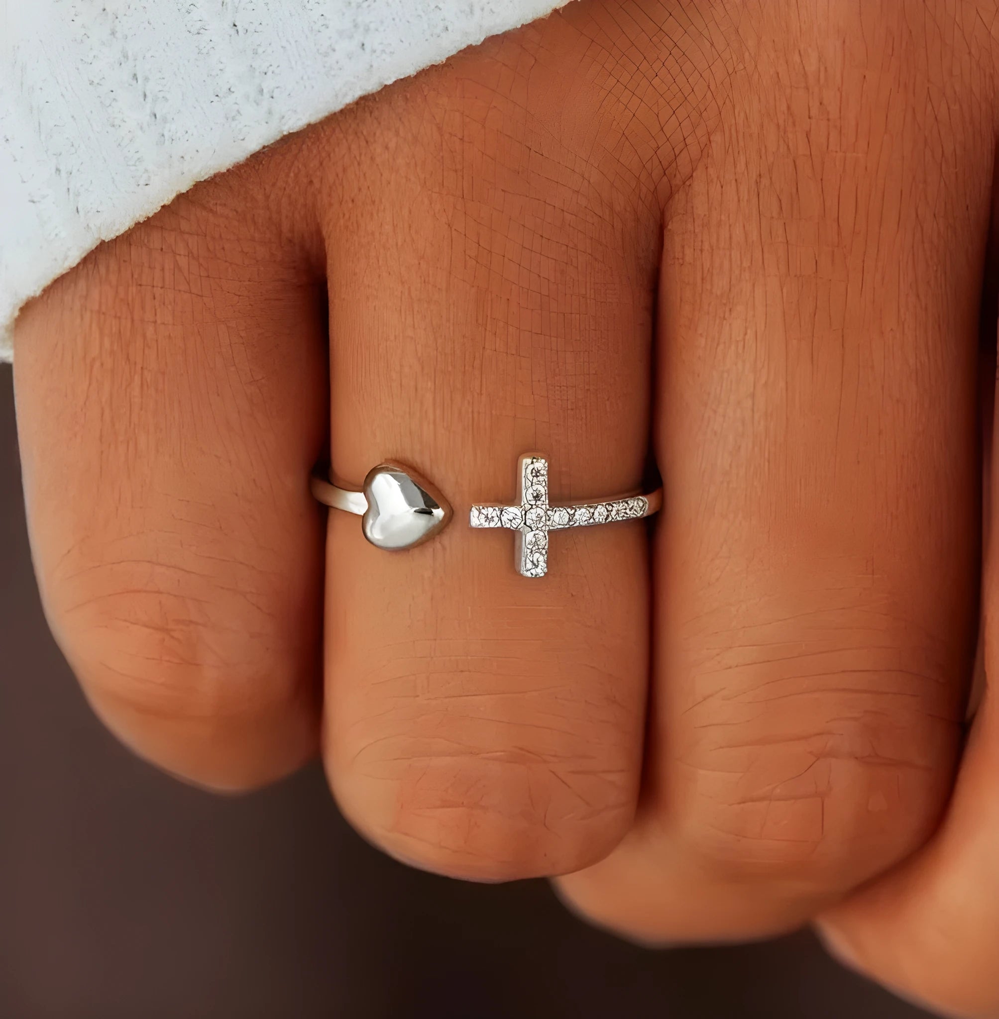 S925 sterling silver love cross women's open ring in white gold and rose gold on white background