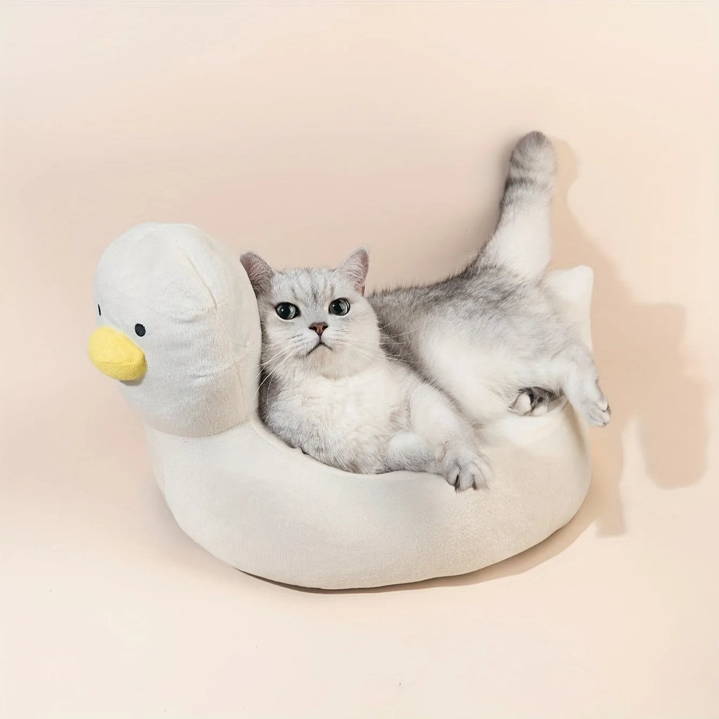 Blue duck-shaped fluffy pet bed for small dogs and cats on a floor