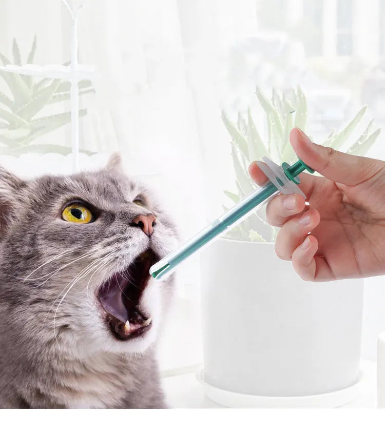Two pet pill shooters with soft tip syringes for administering tablets to cats and dogs