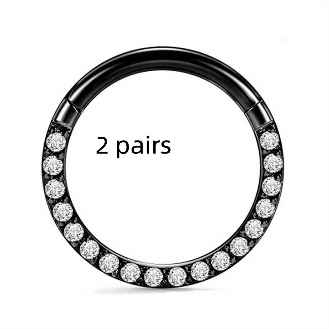 Two pairs of round, seamless 316 stainless steel nose rings showing black, gold, rose gold, and steel colour finishes.