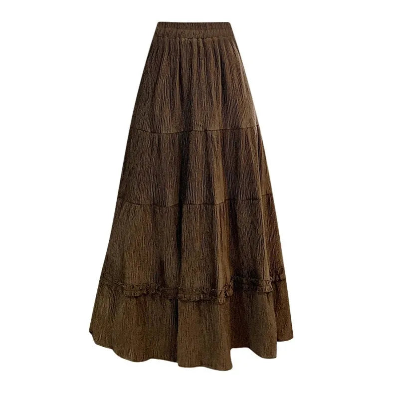 Korean-style beige corduroy A-line midi skirt with an elasticated waistband on a hanger.