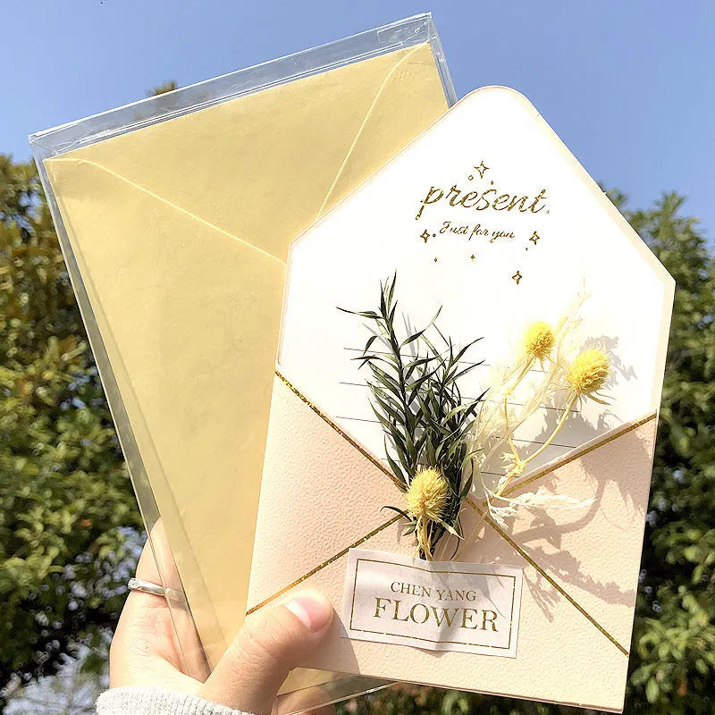 Handmade 3D boxed greeting card with butterfly shape, hot stamping, and artificial flowers on coated paper.
