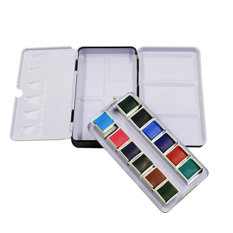 Tinplate metal watercolour paint box for solid pigments in three folding sizes.