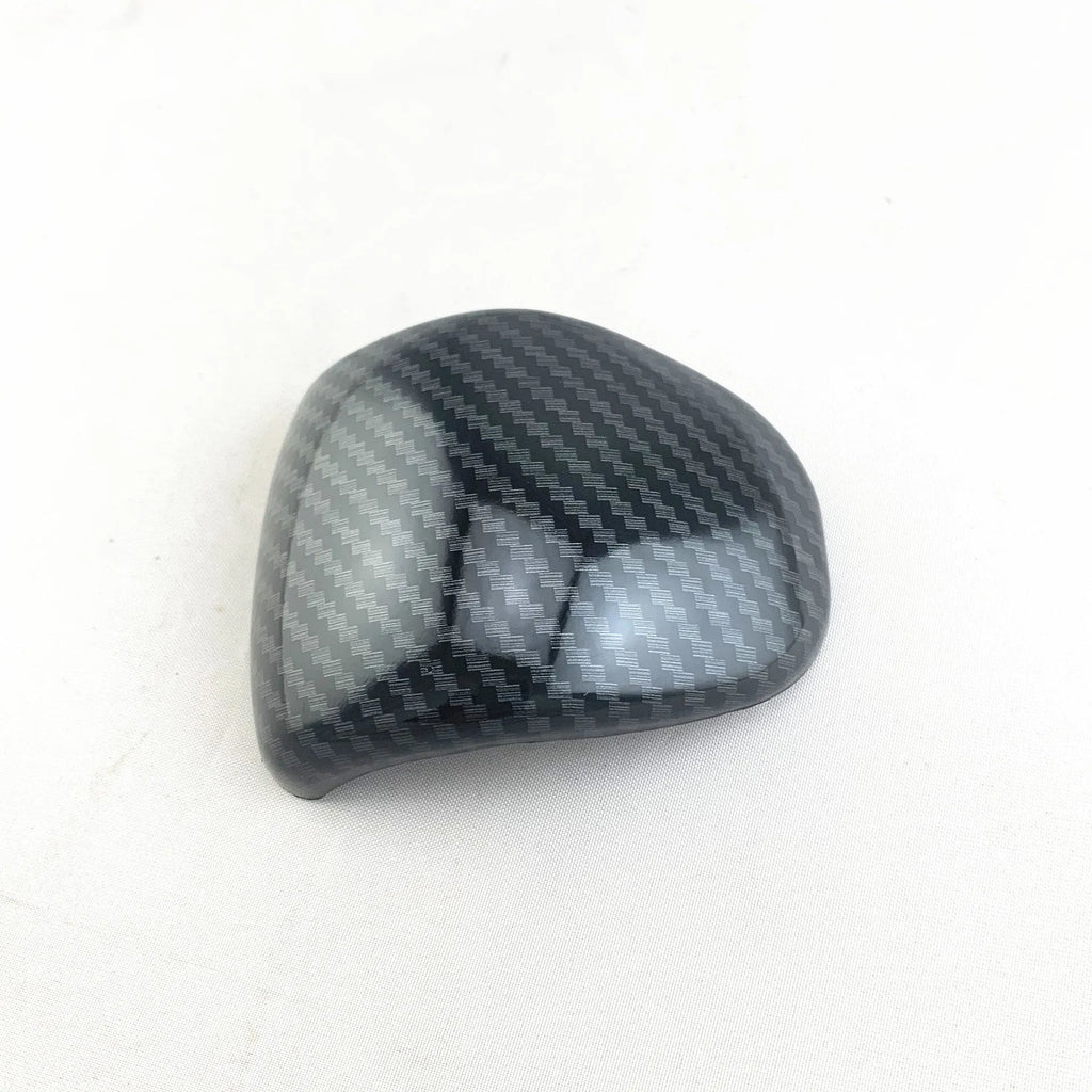Smart RunK3 gear shift cover in carbon fibre pattern made from black ABS plastic.