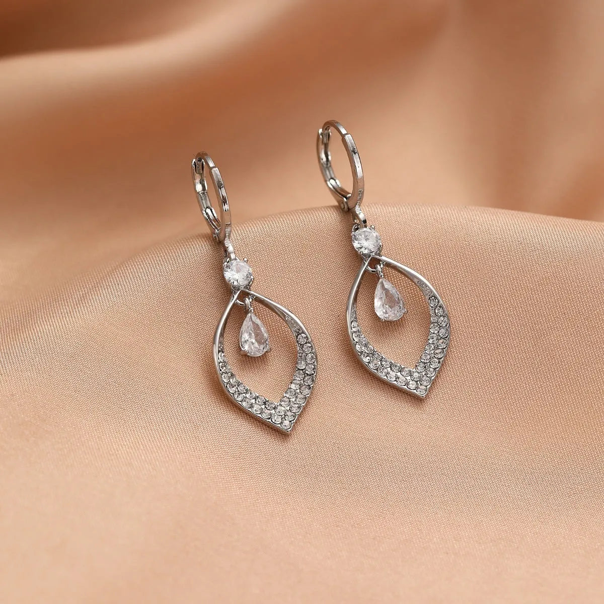 Women's gold or silver coloured zircon water drop earrings with a dangling tassel.