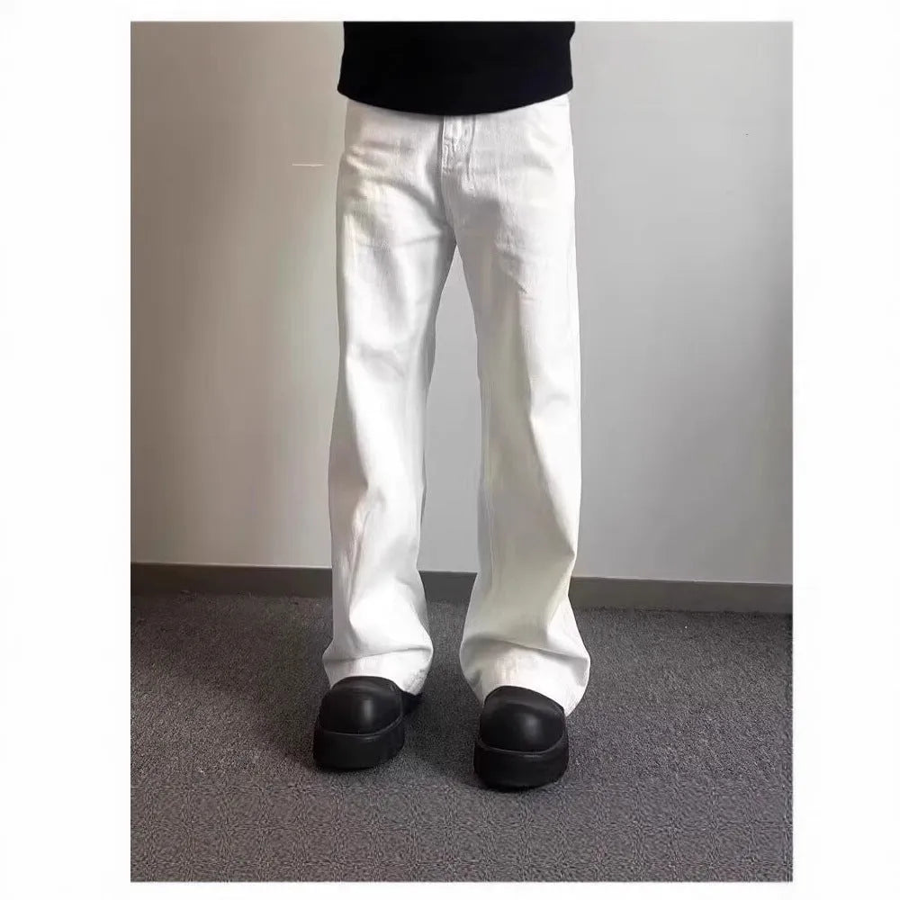 Men's white loose fit wide-leg straight denim jeans on a mid-waist model.
