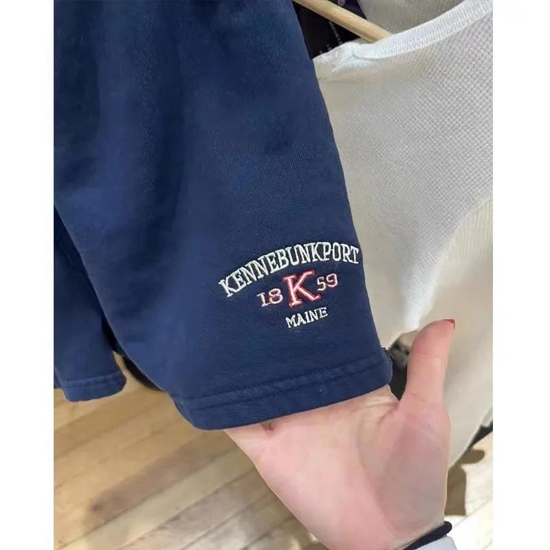 Women's navy blue cotton sports hot pants with white flag embroidery and high top styling