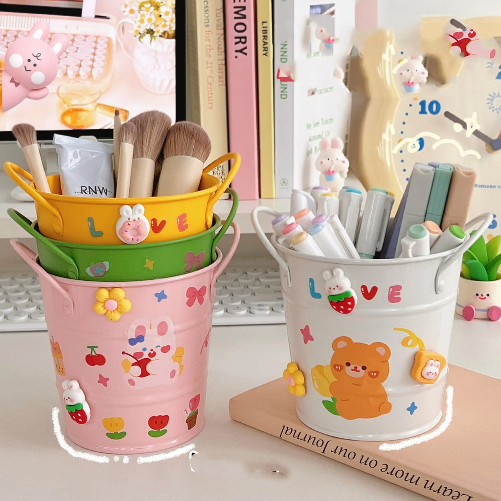 Round metal pen holder with decorative iron art design in multiple colour options