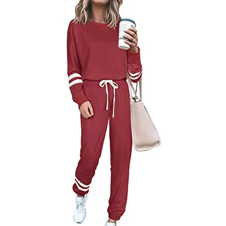 Women's plus size loose-fitting casual suit in a solid colour with long sleeves and matching trousers.
