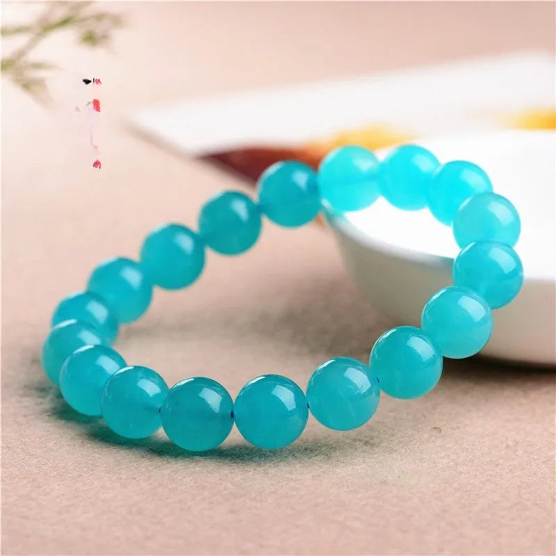 Grade 7A Amazonite natural scattered beads in blue-green ice colours with polished surfaces