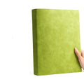 A4 thickened imitation leather notebook with soft cover in black, open to show ivory white pages