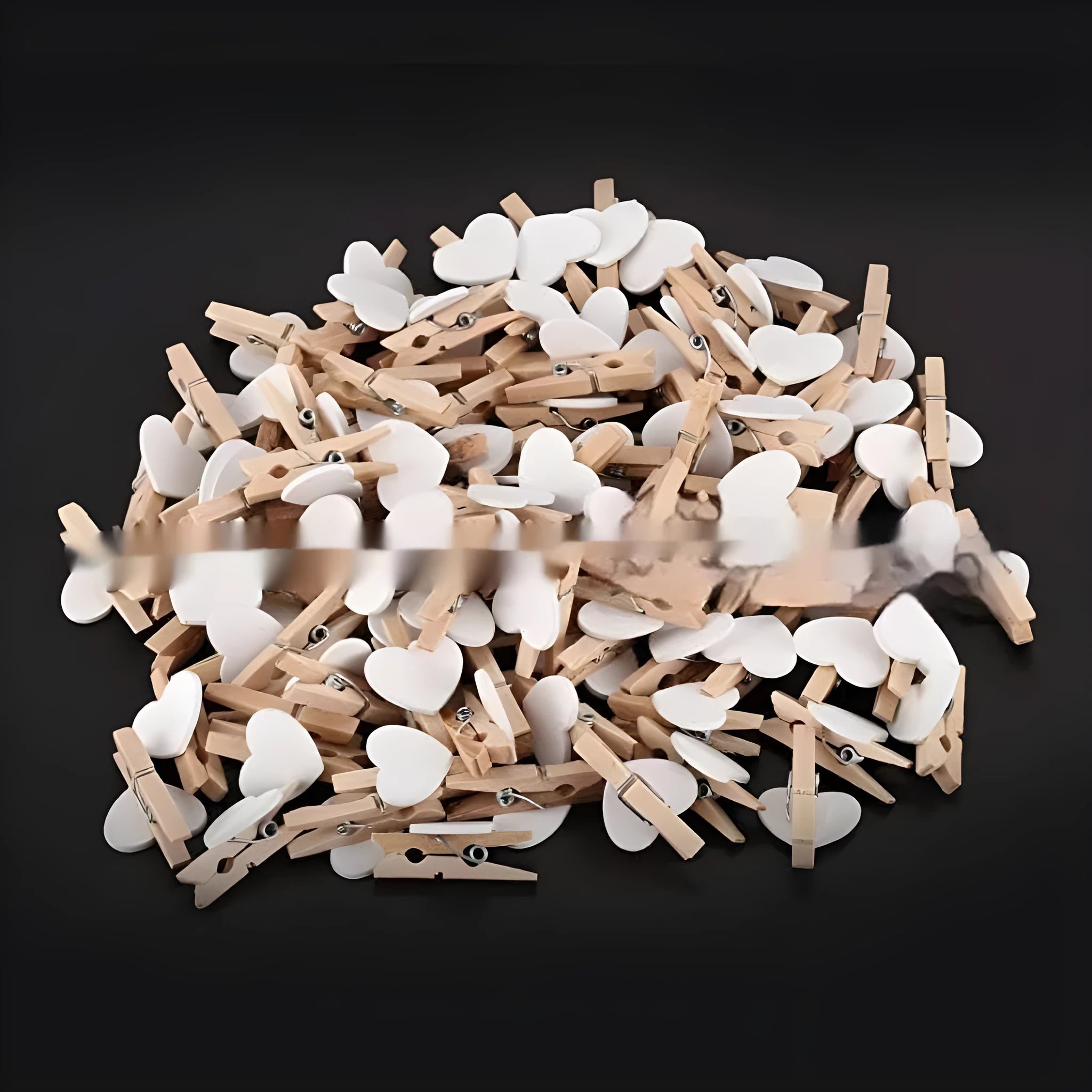 Set of five solid wood heart-shaped clips in red, white, and rose red on a plain surface.