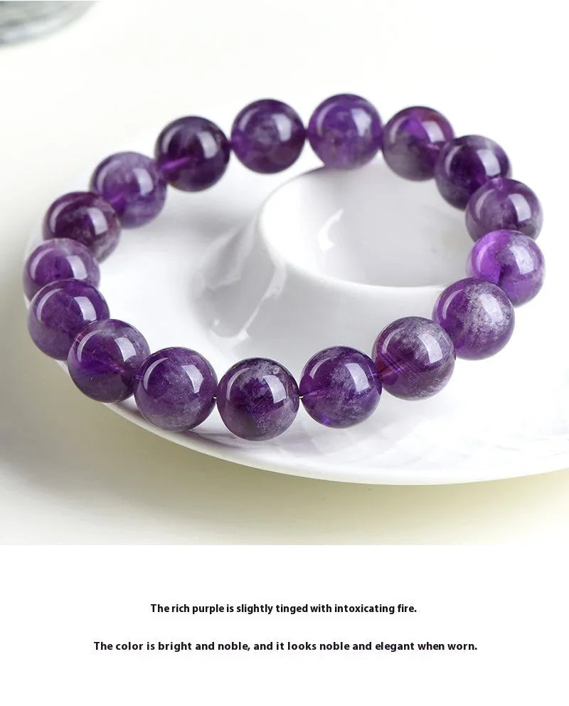 Natural feather amethyst crystal bracelet with scattered Snow Mountain purple beads and Ruyi detail.
