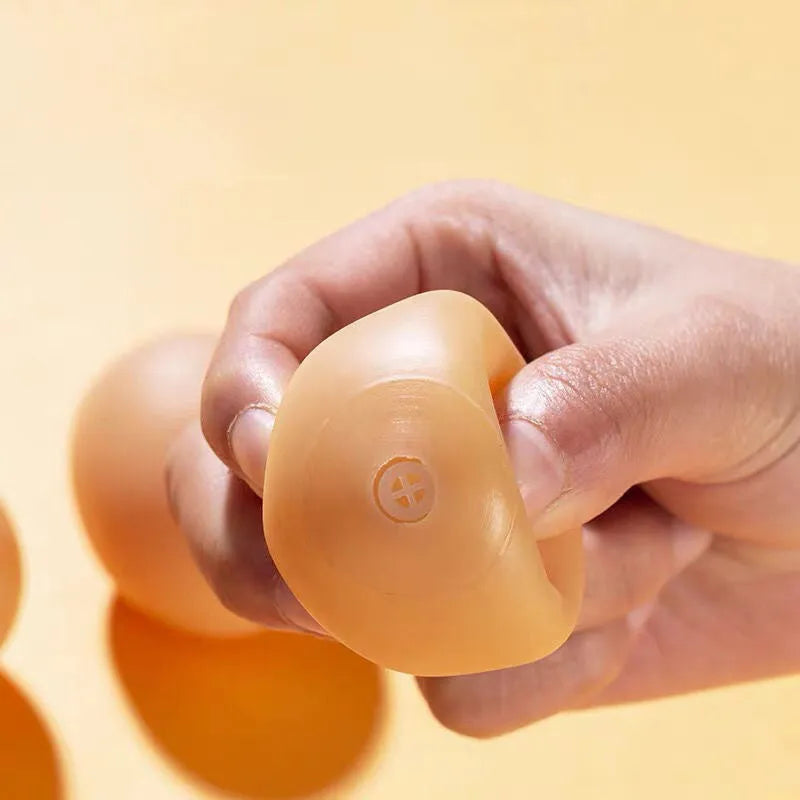 Egg-shaped plush dog chew toy with squeaker for small to medium breed puppies