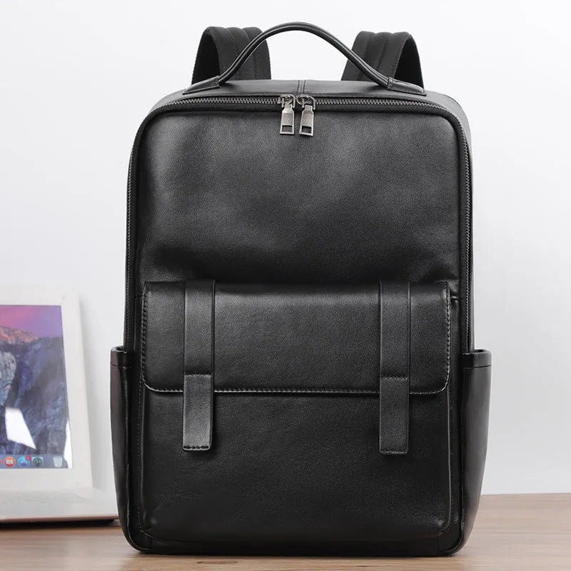 Men's black leather computer backpack showing front view with woven design elements