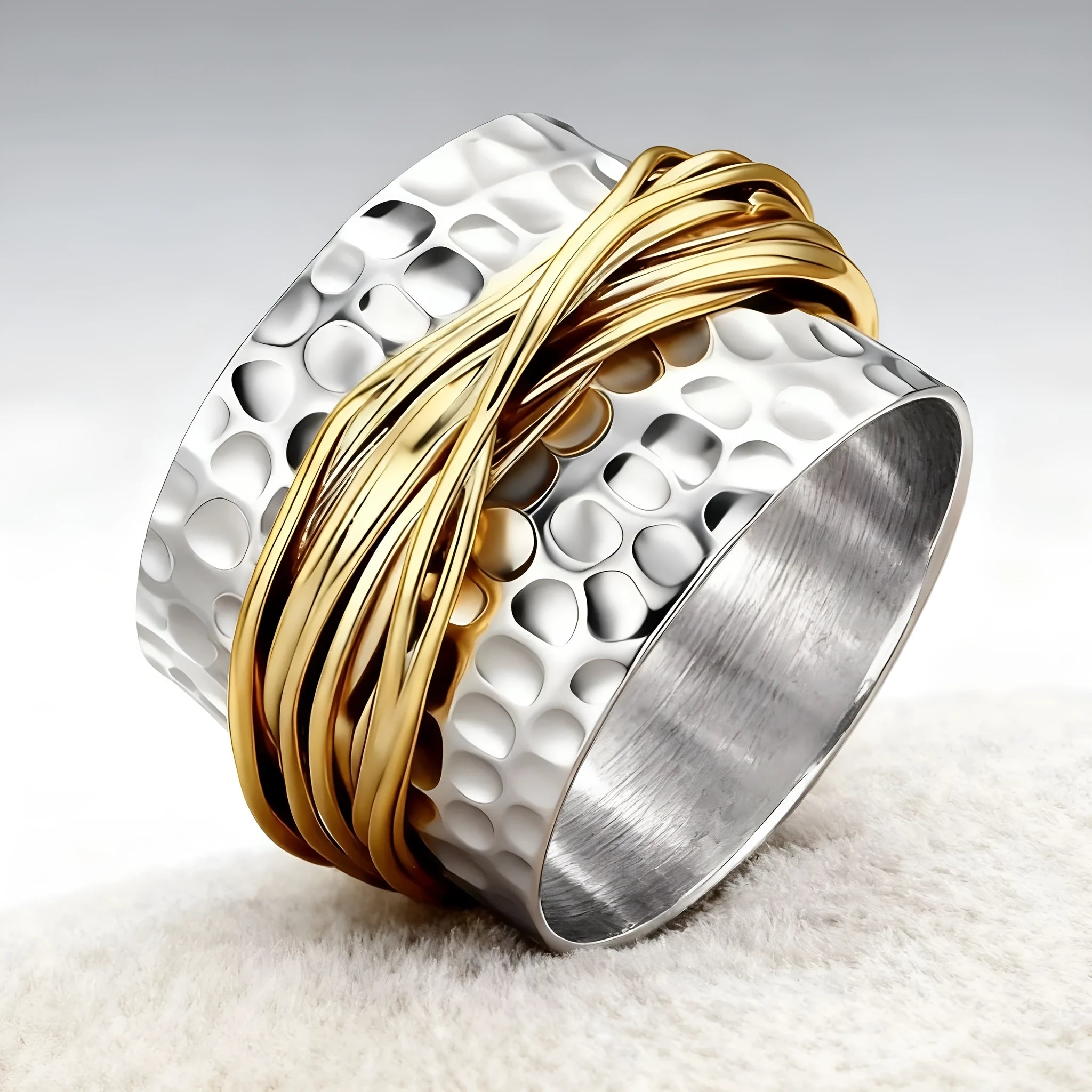 Alloy hammered metal coil ring with electroplated two-tone finish available in sizes 6 to 10