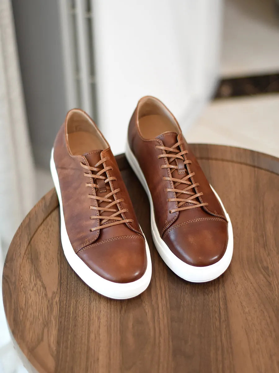Men's handmade first-grain horse leather distressed casual shoes in dark brown with lace-up closure and stitching