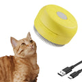 Rechargeable green and yellow silicone steam brush for grooming cats and dogs