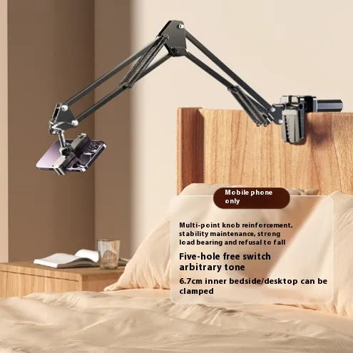 Universal alloy lazy bracket holding a mobile phone on a bedside table