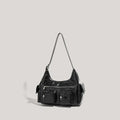 Black PU leather shoulder motorcycle bag with sewing line details against a plain background