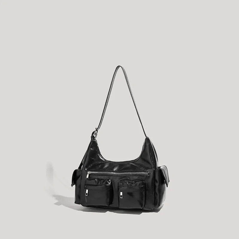 Black PU leather shoulder motorcycle bag with sewing line details against a plain background