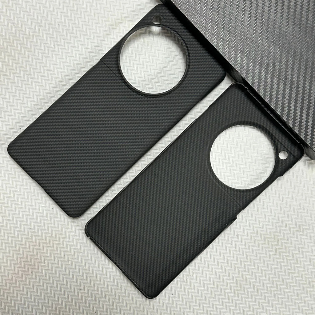 Black hand-woven Kevlar anti-wear phone case for OnePlus 12 with crater texture