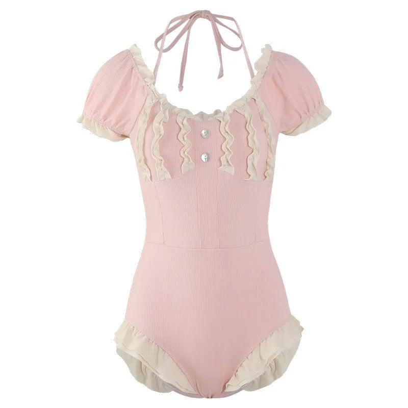 Pink women's one-piece swimsuit with conservative Siamese cut design on mannequin