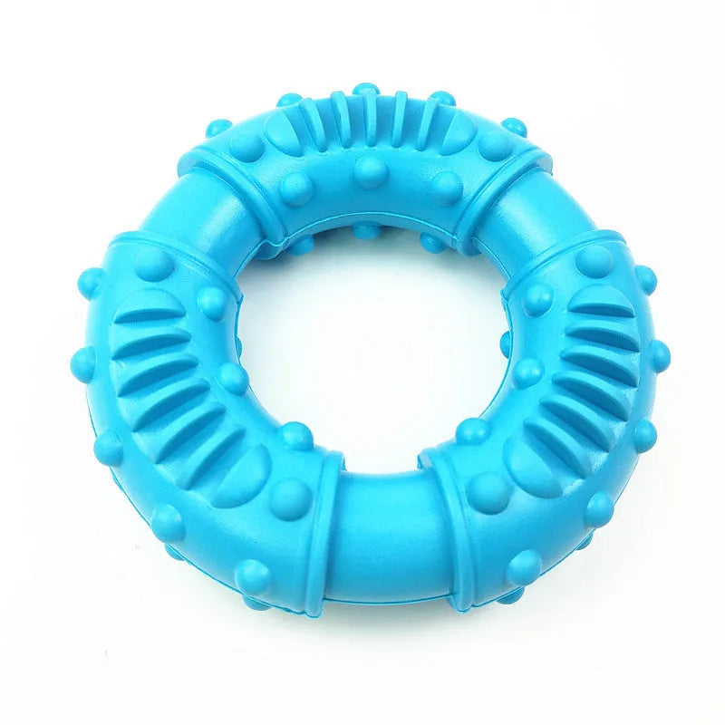 Blue hollow dog fetch stick toy on grass, showing its lightweight chewy construction for safe fetching games