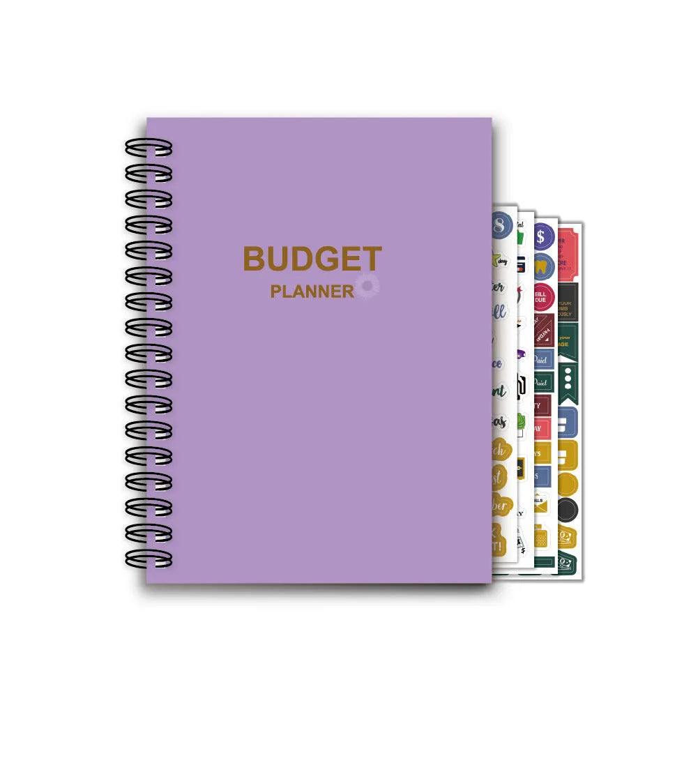 Purple coil-bound financial planning notebook with stickers, pen, and paper clips for monthly budget tracking