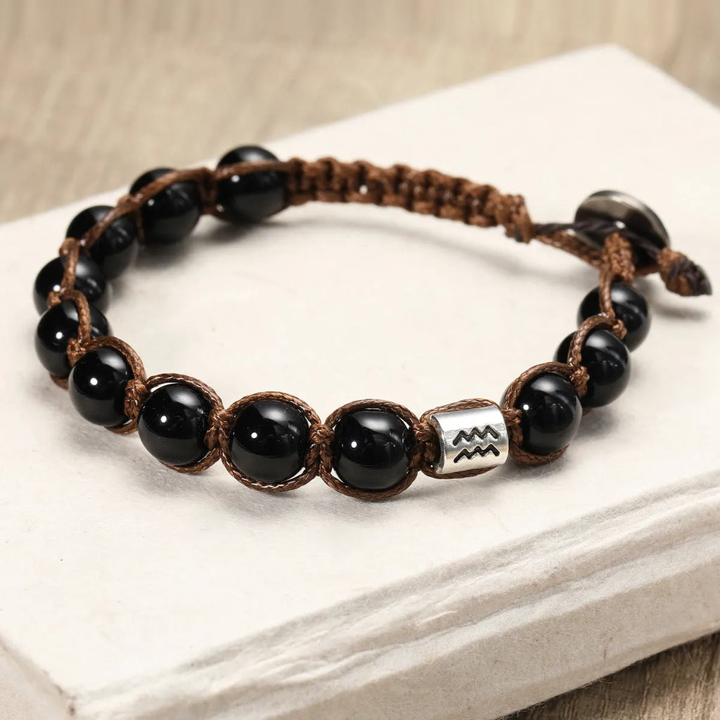 Natural obsidian hand-woven zodiac bracelet with stainless steel accent, unisex design