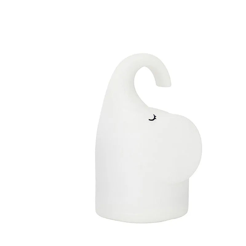 DOMI Elephant silicone night light with soft white glow on bedside table