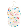 Colourful cartoon umbrella pattern pet raincoat for a small dog on a grey background.