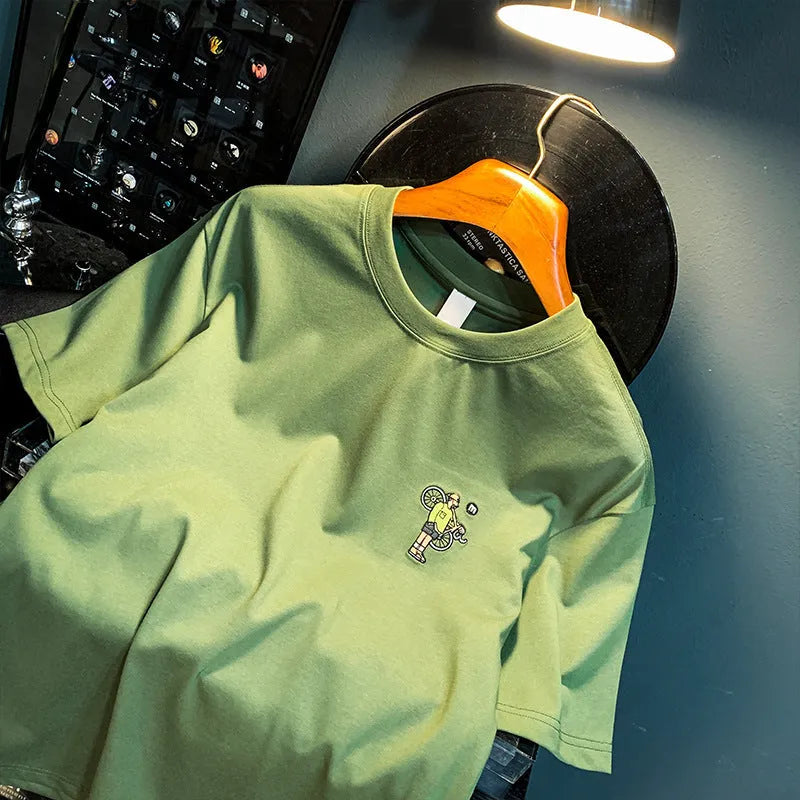 Green men's printed loose fit t-shirt with short sleeves shown on Asian sizing chart